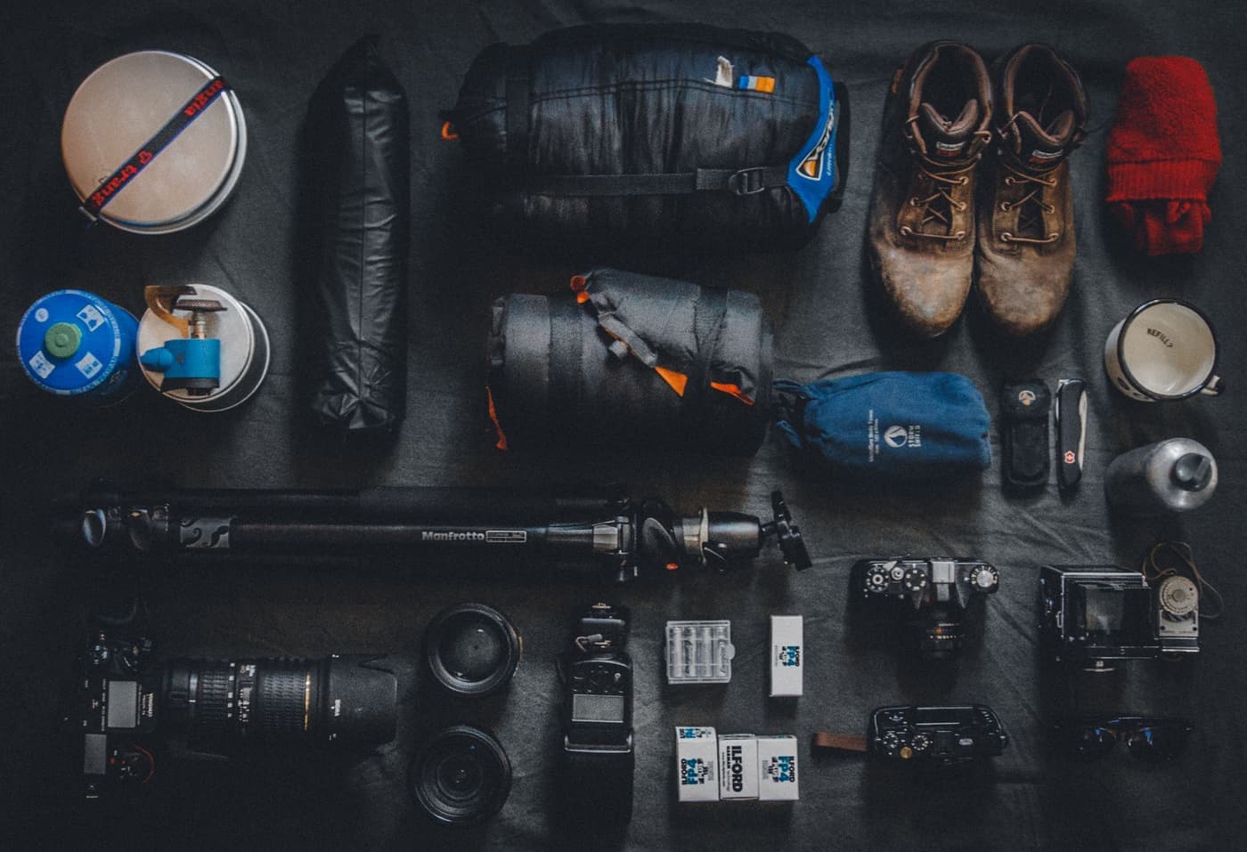 Camping and power gear laid out on a flat surface