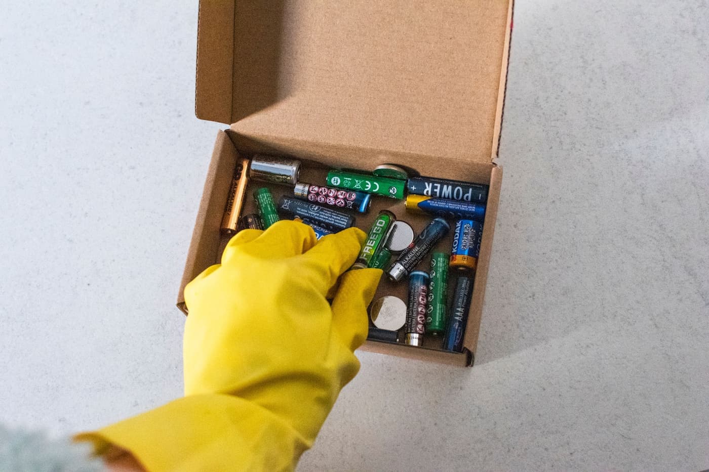 Worn batteries in a recycling container