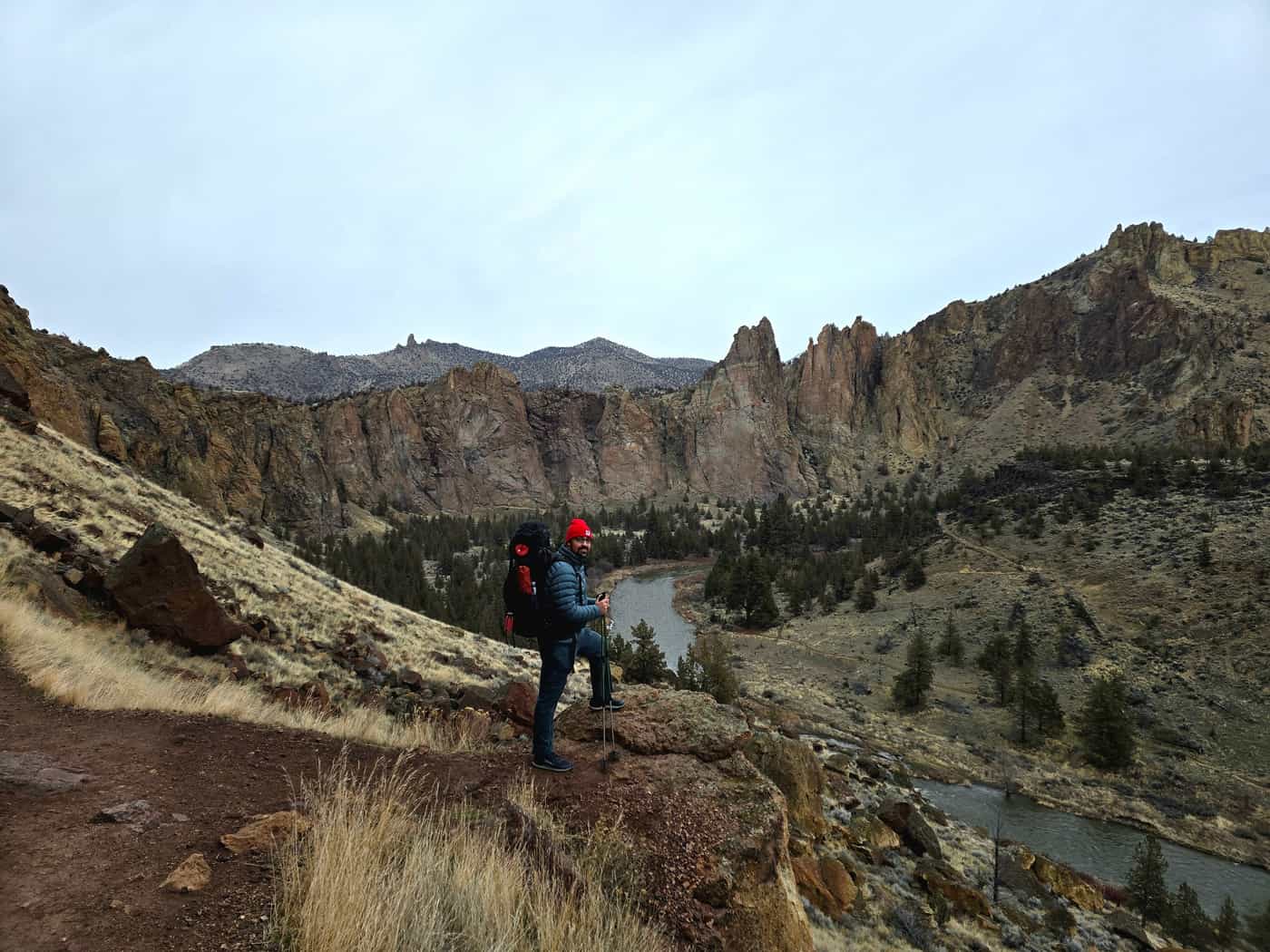 Minimal lightweight hiking gear arranged on a trail