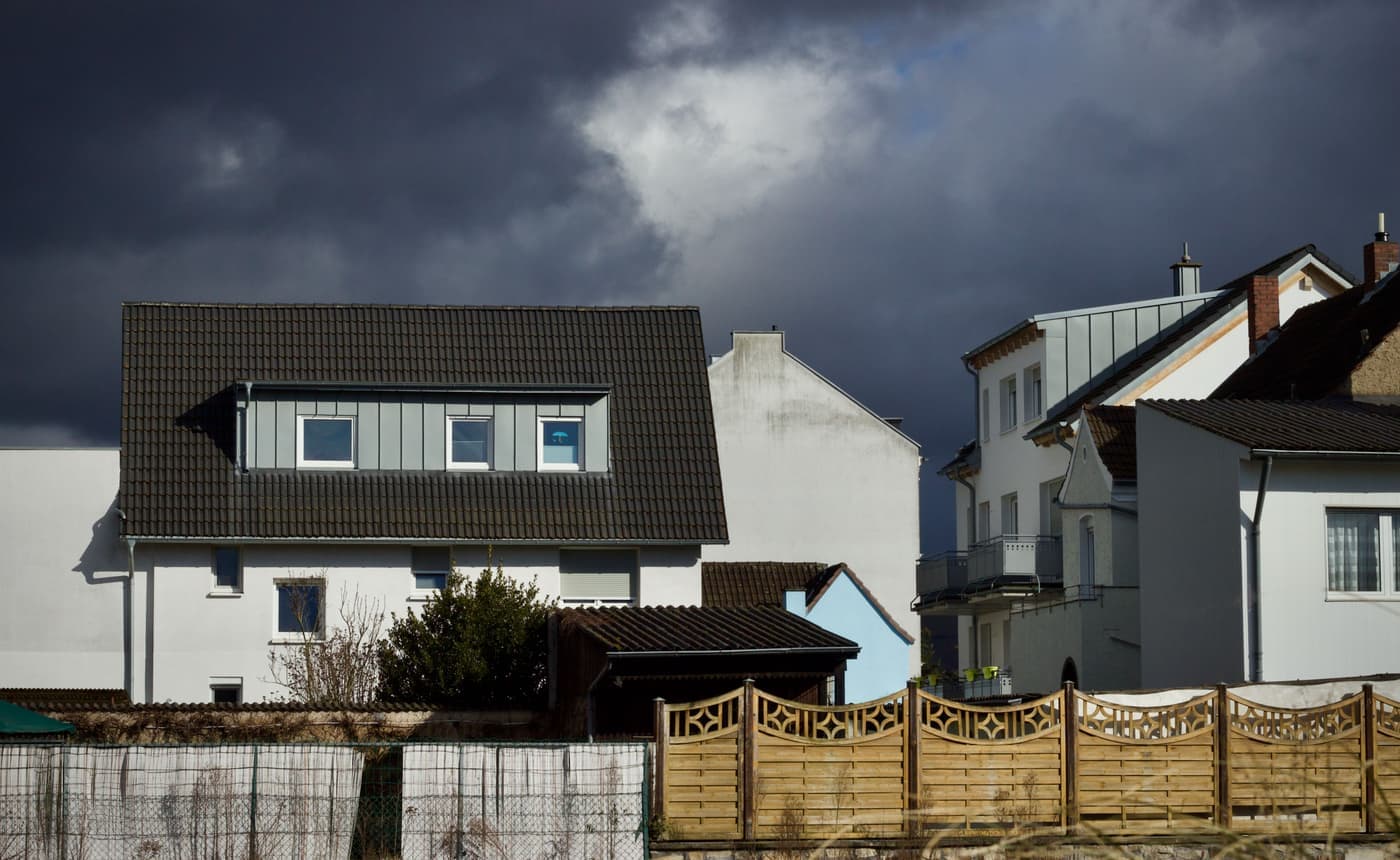 Storm clouds gathering over a residential neighborhood