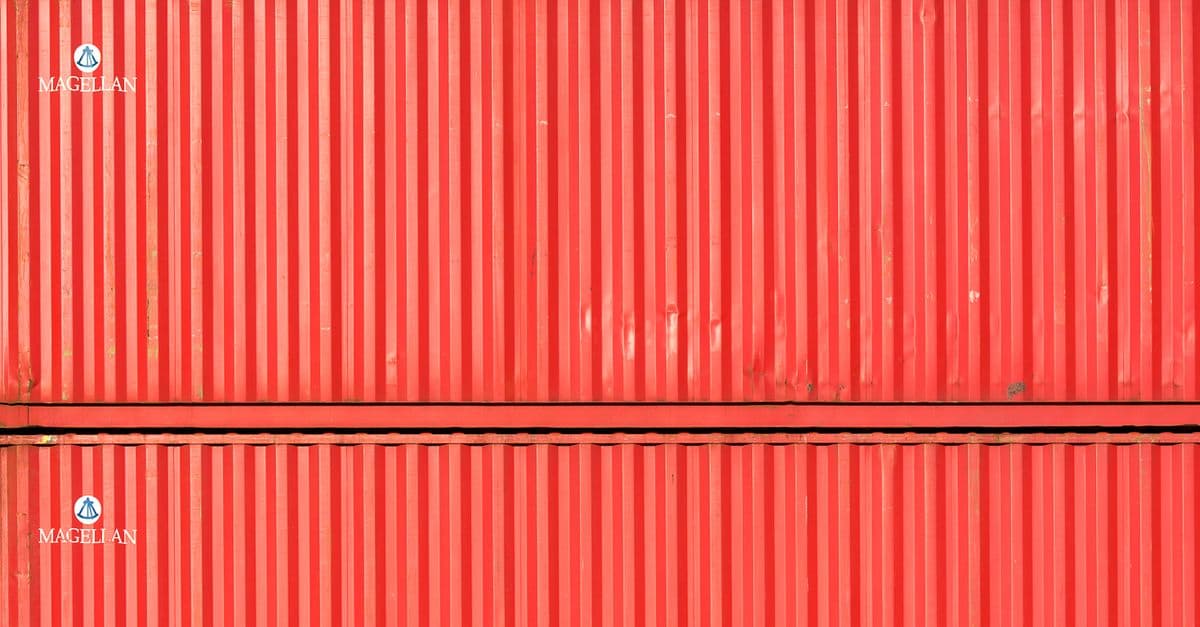 Stacked shipping containers forming a wall of modular units