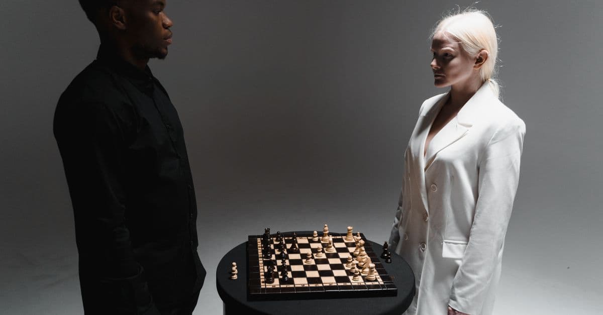 Two players facing each other across a chess board