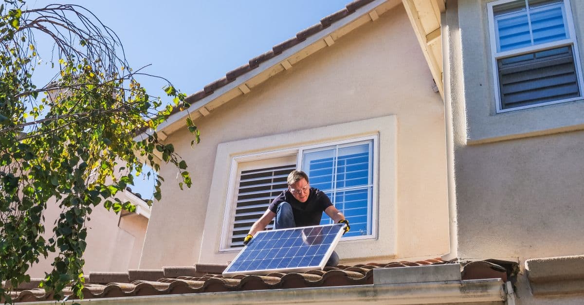 Solar panels being installed in bright sunshine