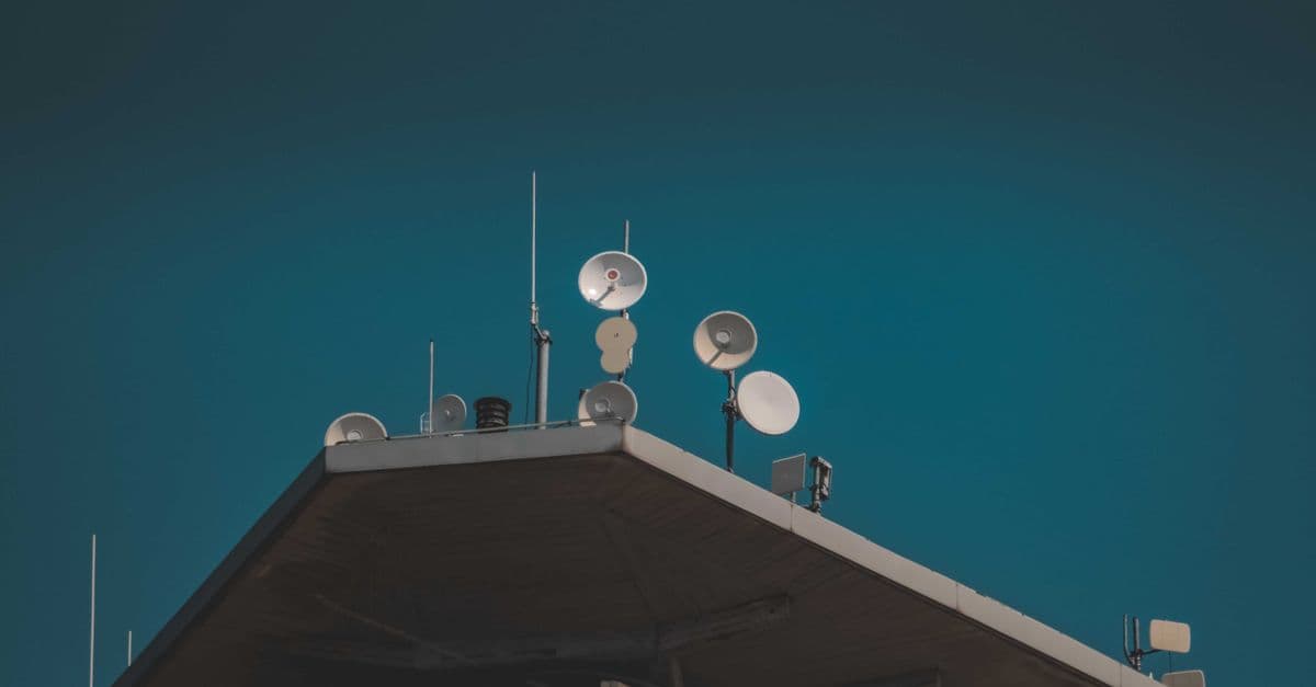 Communication dishes and antennas against a clear blue sky