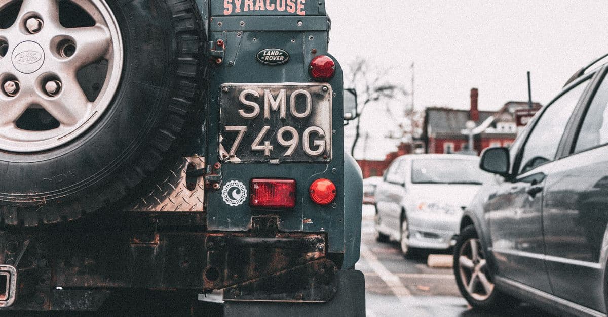 A vehicle parked in an open lot before an event