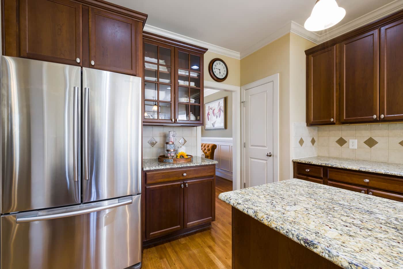 A home refrigerator with its door open, lit from inside