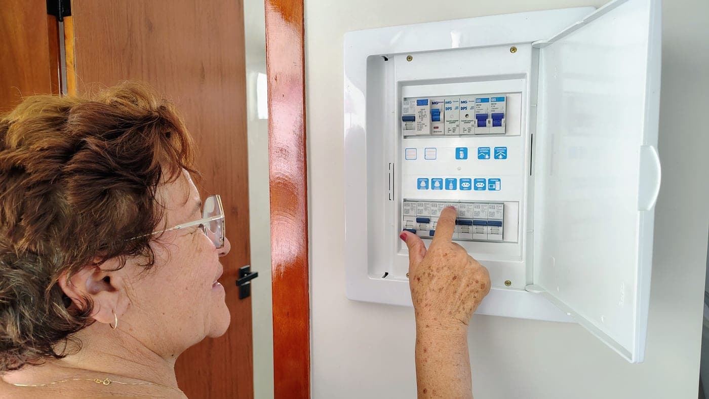 A residential electrical panel with the breaker door open