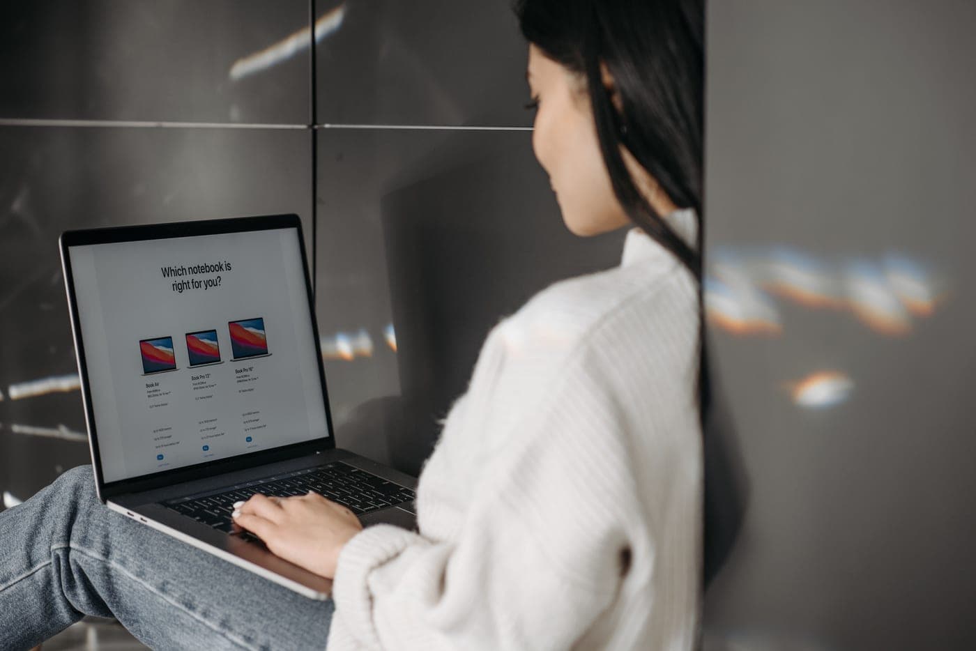 A laptop open on a desk with product research on screen