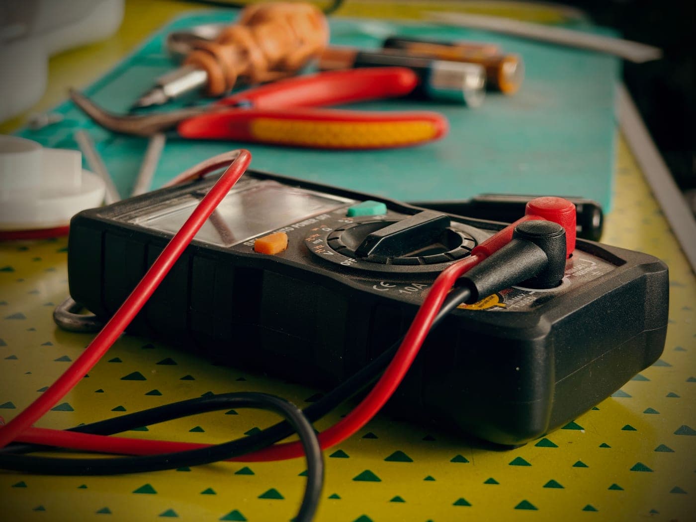A technician taking a reading with a multimeter